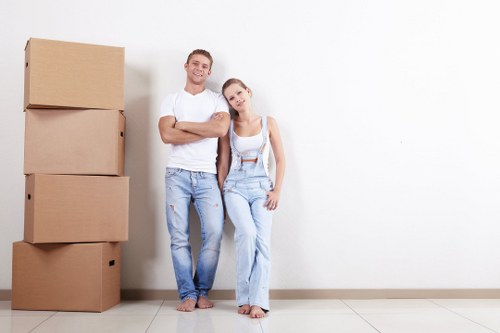 Commercial moving team handling office relocation equipment in a local business area