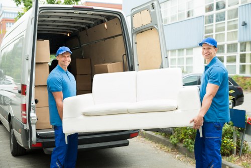 Removal van hire team sorting recyclable household items for a sustainable move