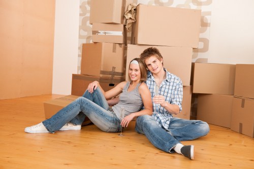 Removal van loading scene with moving boxes and a hired vehicle