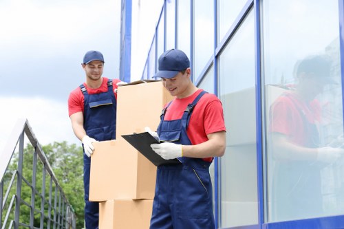 Packed moving boxes and furniture loaded into a removals van