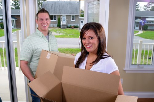 Local man and van removals team loading furniture for a move in Hire