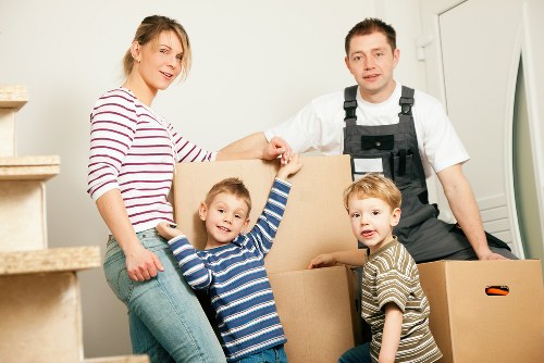 Furniture pickup team handling bulky items in a local Hire property