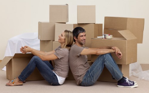 Household items being unloaded into a new home in Hire