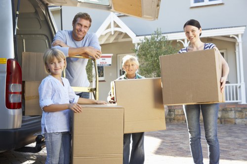 Packed boxes and wrapped furniture ready for home removals in Hire