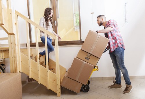 Packed boxes and moving van for removals in Hire