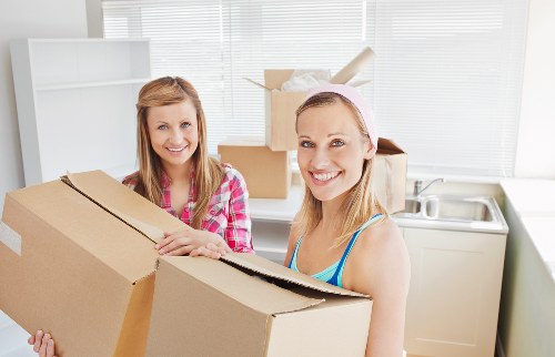 Careful packing of household items for a local move in Hire